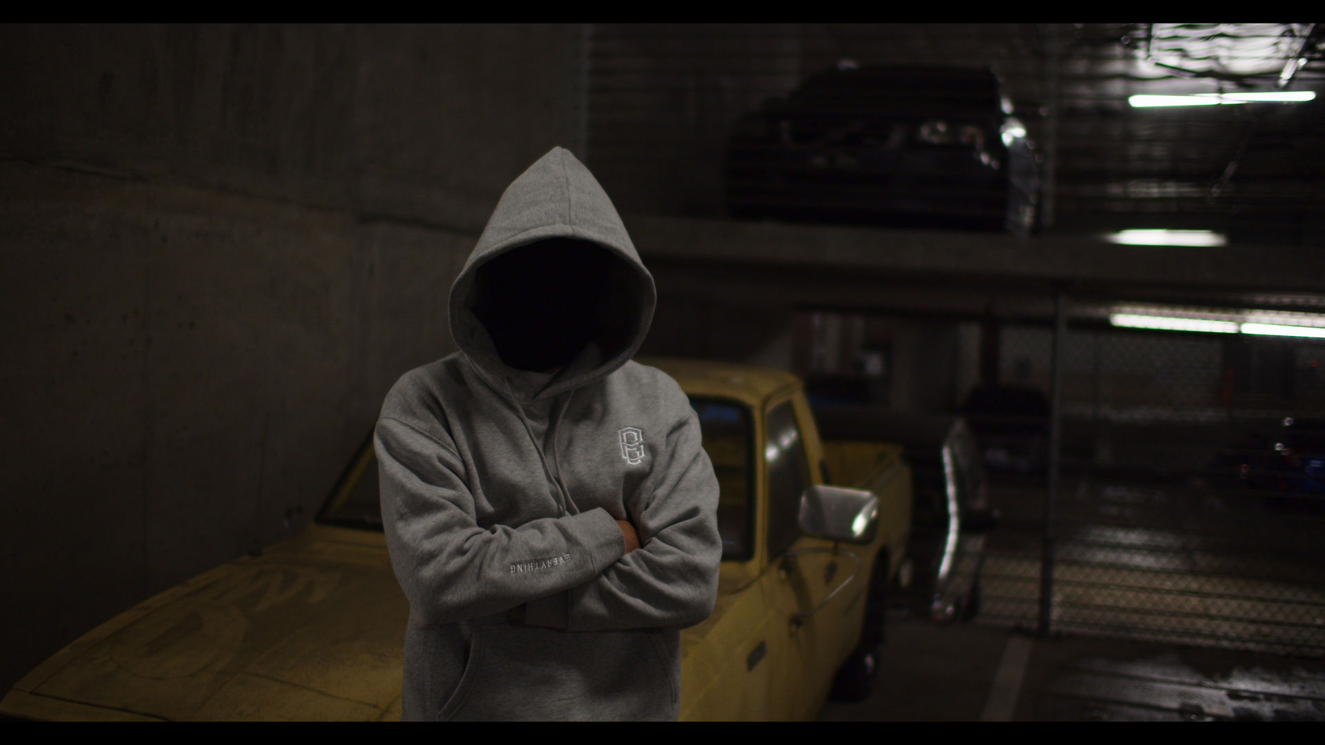 man standing in front of yellow truck